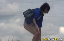 Pissing japanese teenagers get watched