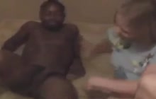 Dirty black dwarf gets a BJ from a white girl