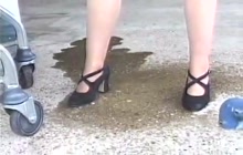Dirty blonde takes a leak on a public parking